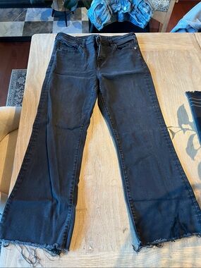 American Eagle next level stretch Women’s Black Flared Jeans with Raw Hem
